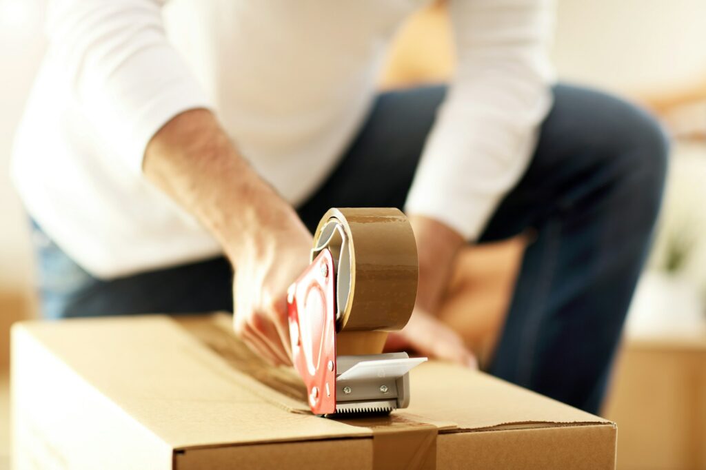 Happy adult couple moving out or in to new home