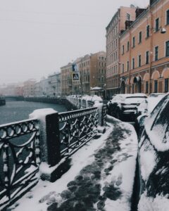 Snowy city or town, many buildings in background